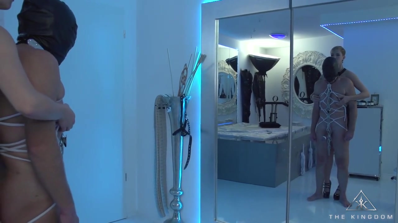 Male slave with tied cock and balls tormented
